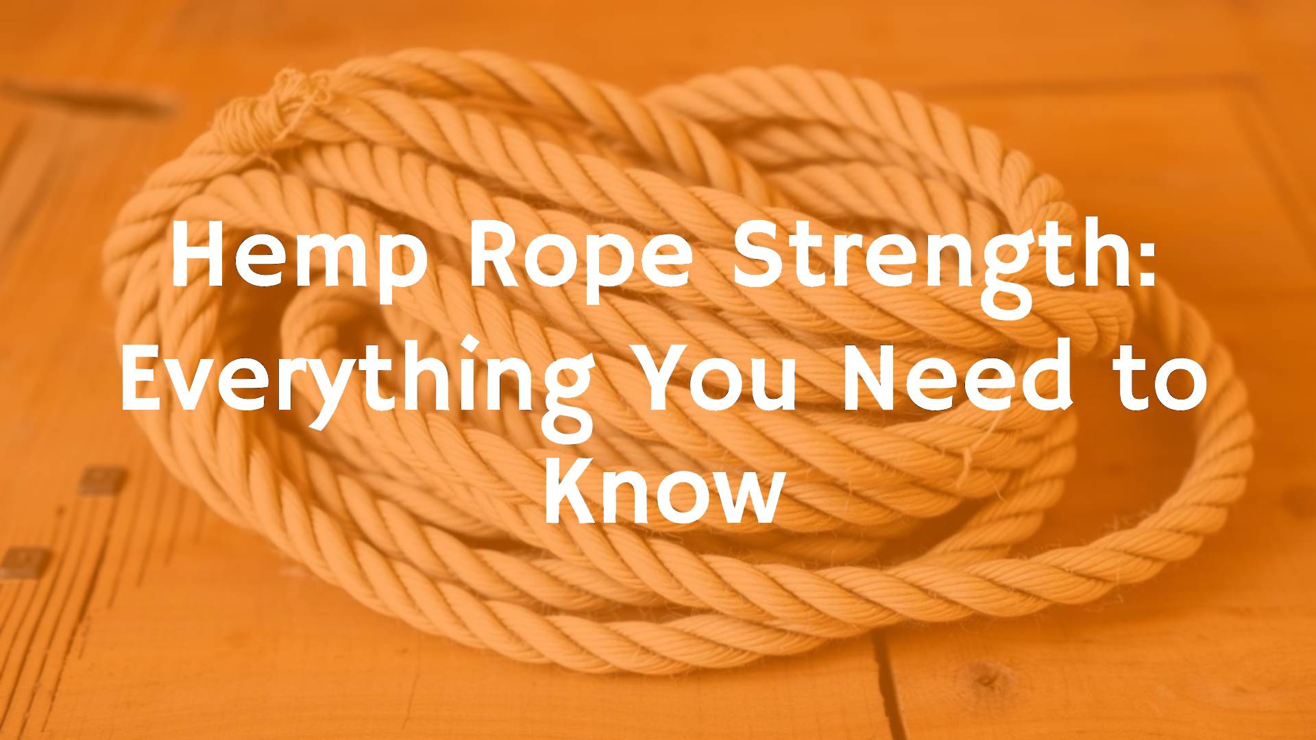 A thick hemp rope coiled neatly on a wooden table, natural fibers visible, rustic and sturdy look, realistic.