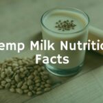 A glass of creamy hemp milk next to hemp seeds on a wooden table, healthy and natural, soft lighting, realistic.